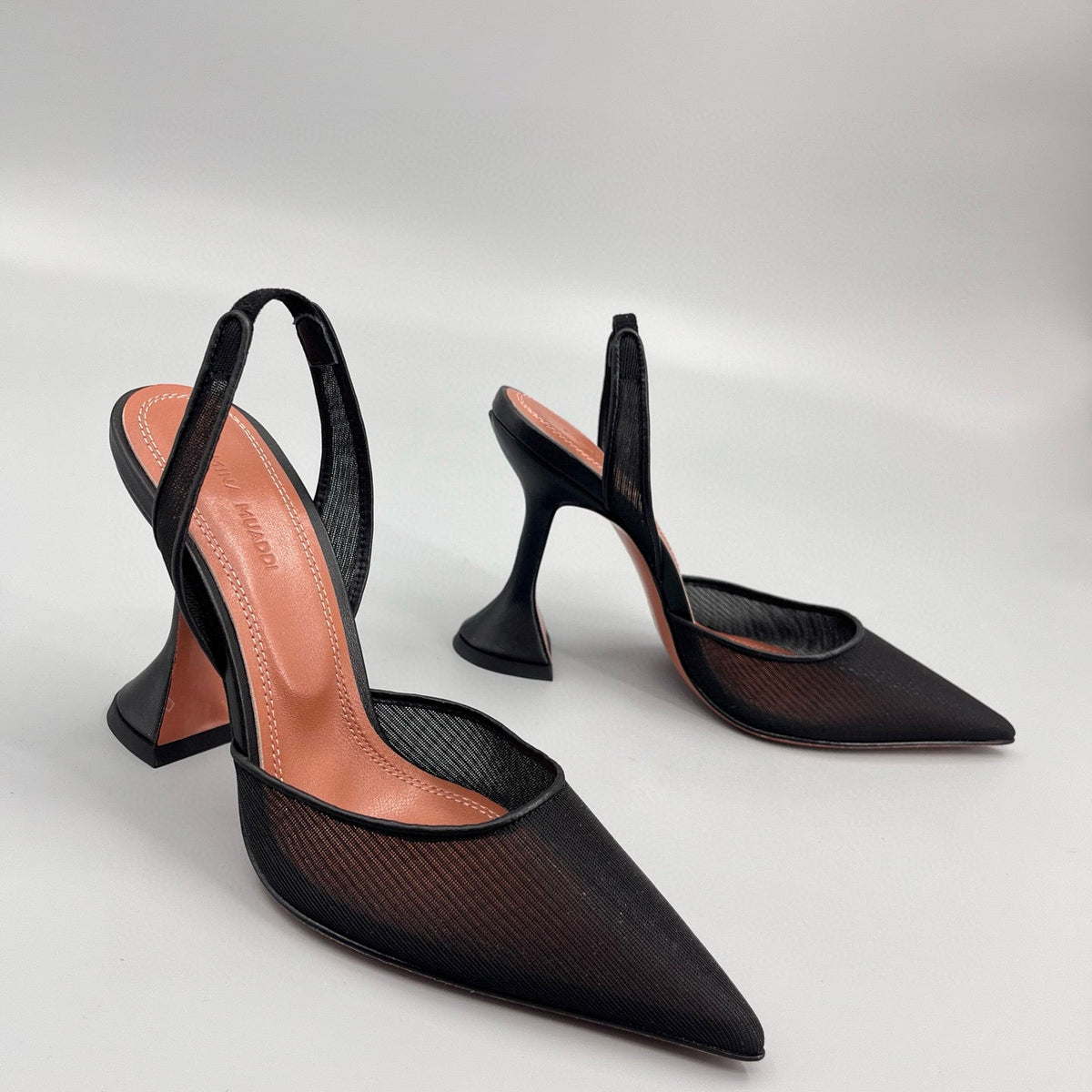 AMINA M HEELS