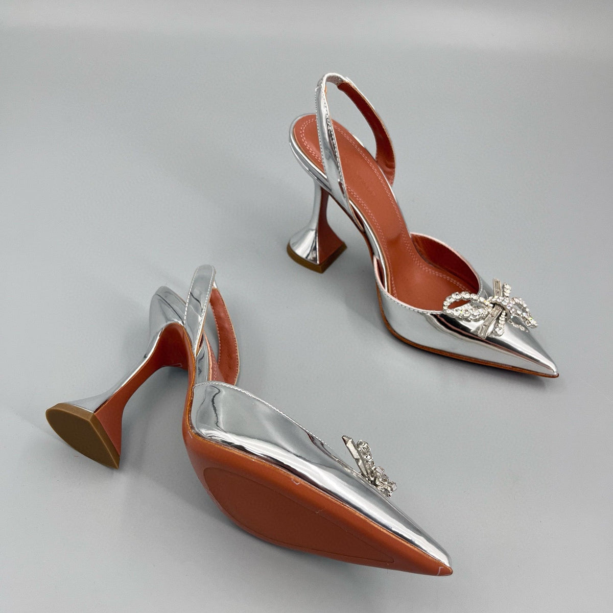AMINA M HEELS