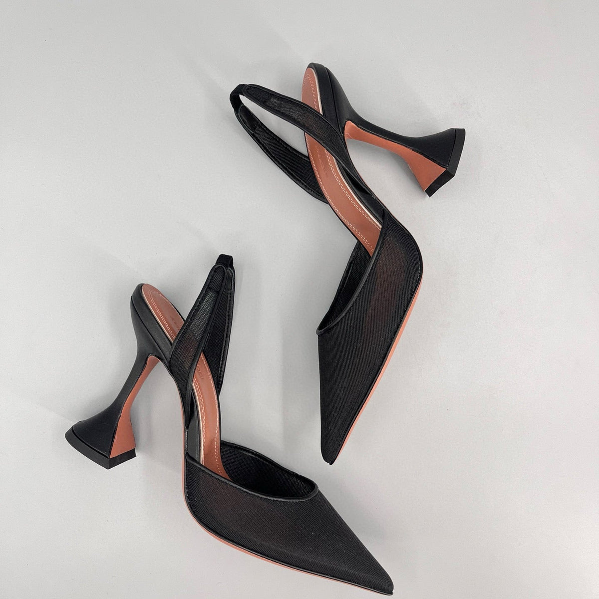 AMINA M HEELS