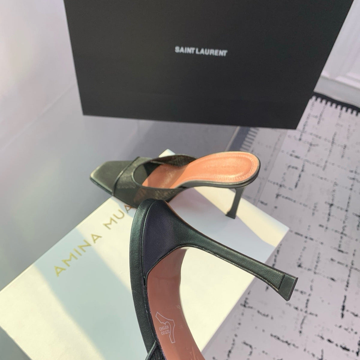 AMINA M HEELS