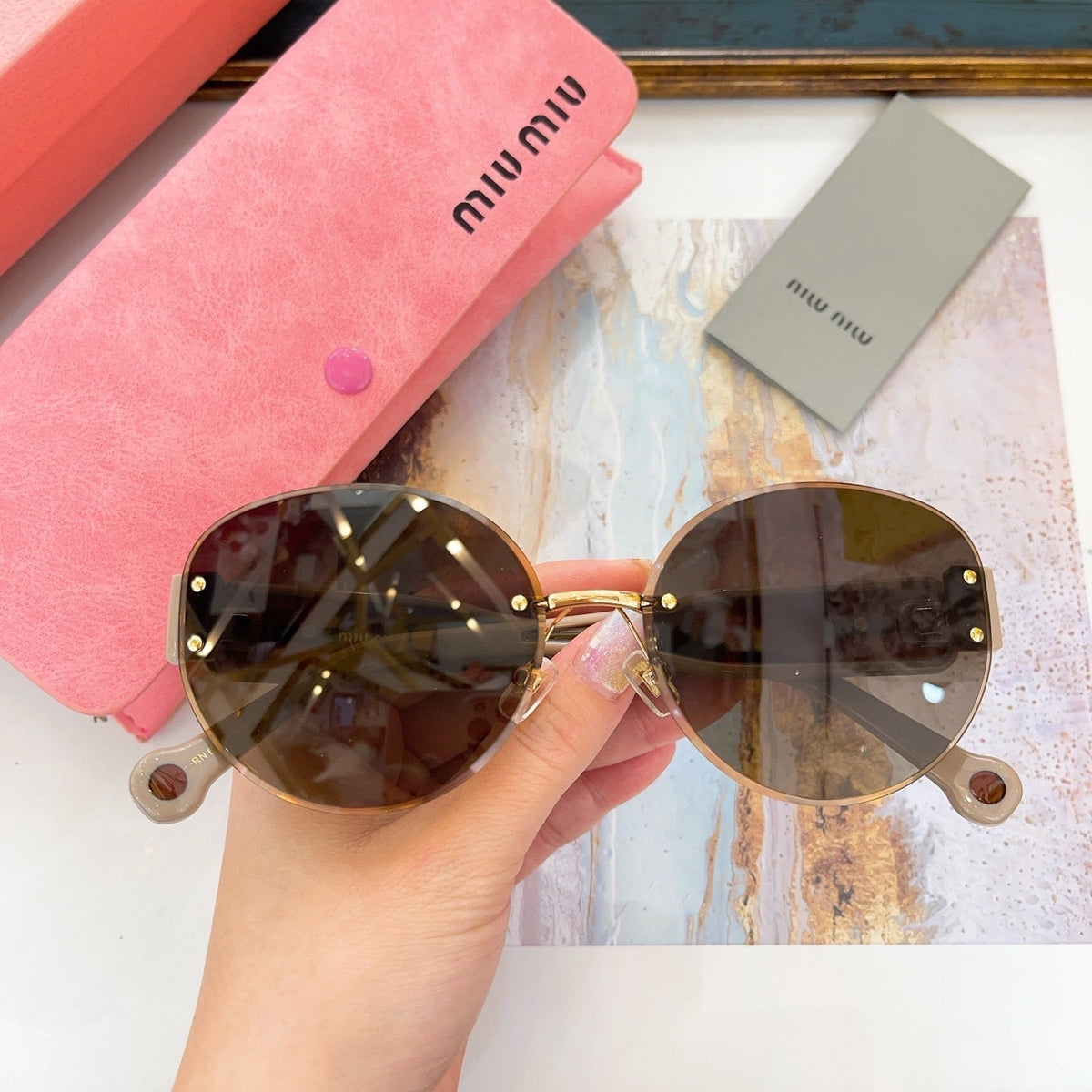 MIU M SUNGLASSES