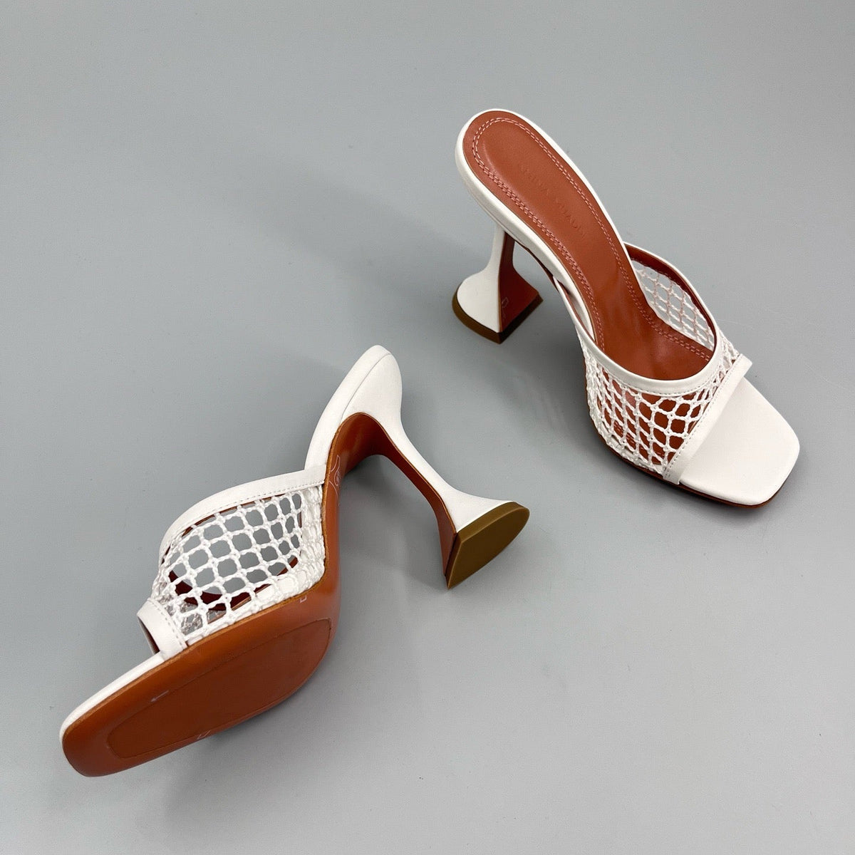 AMINA M HEELS