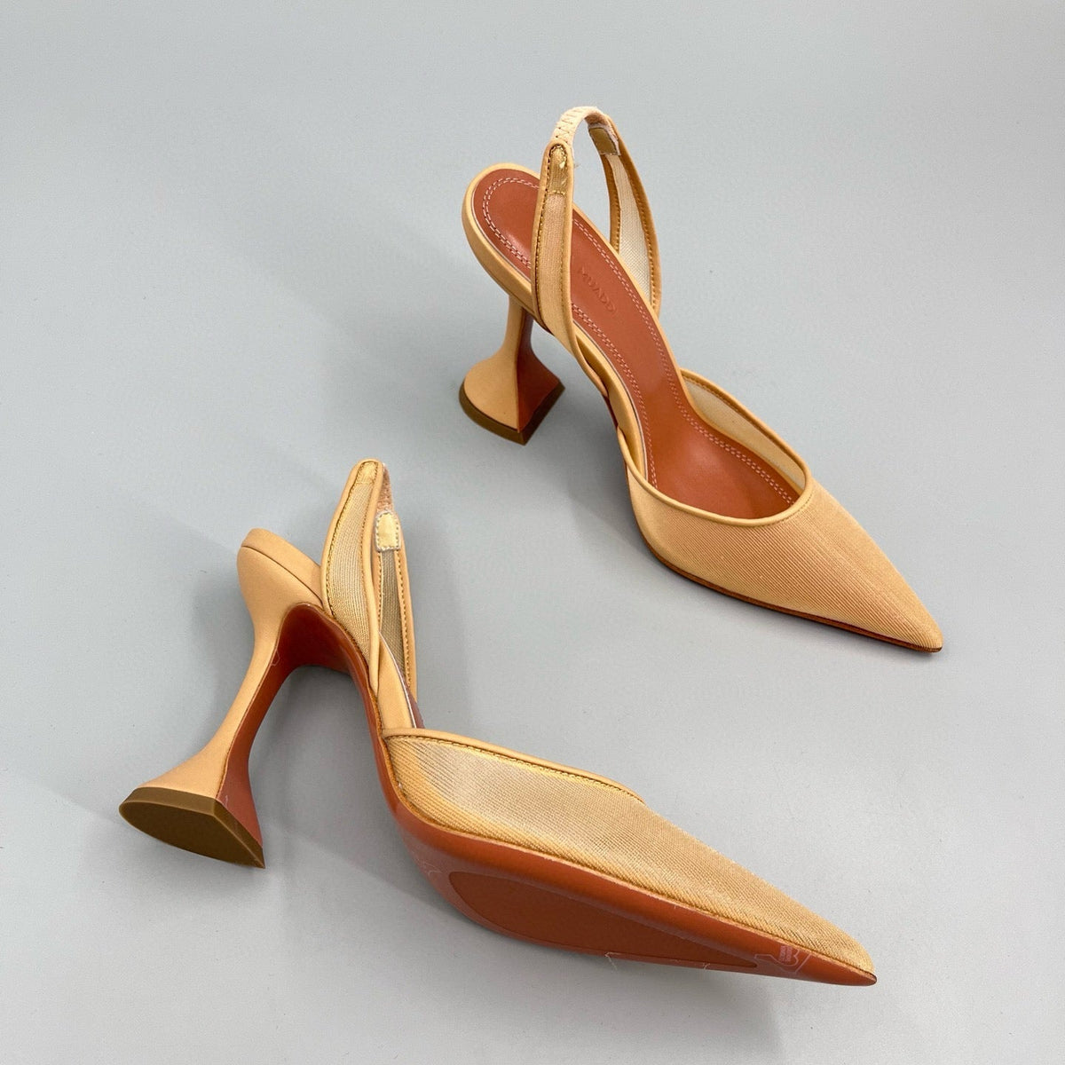 AMINA M HEELS