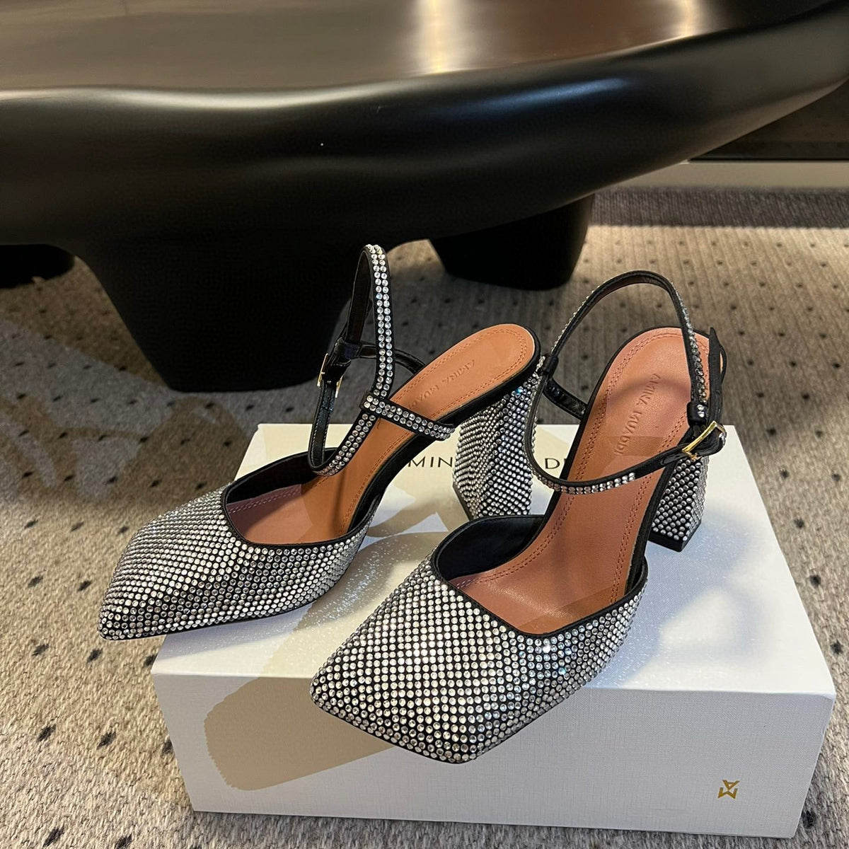 AMINA M HEELS