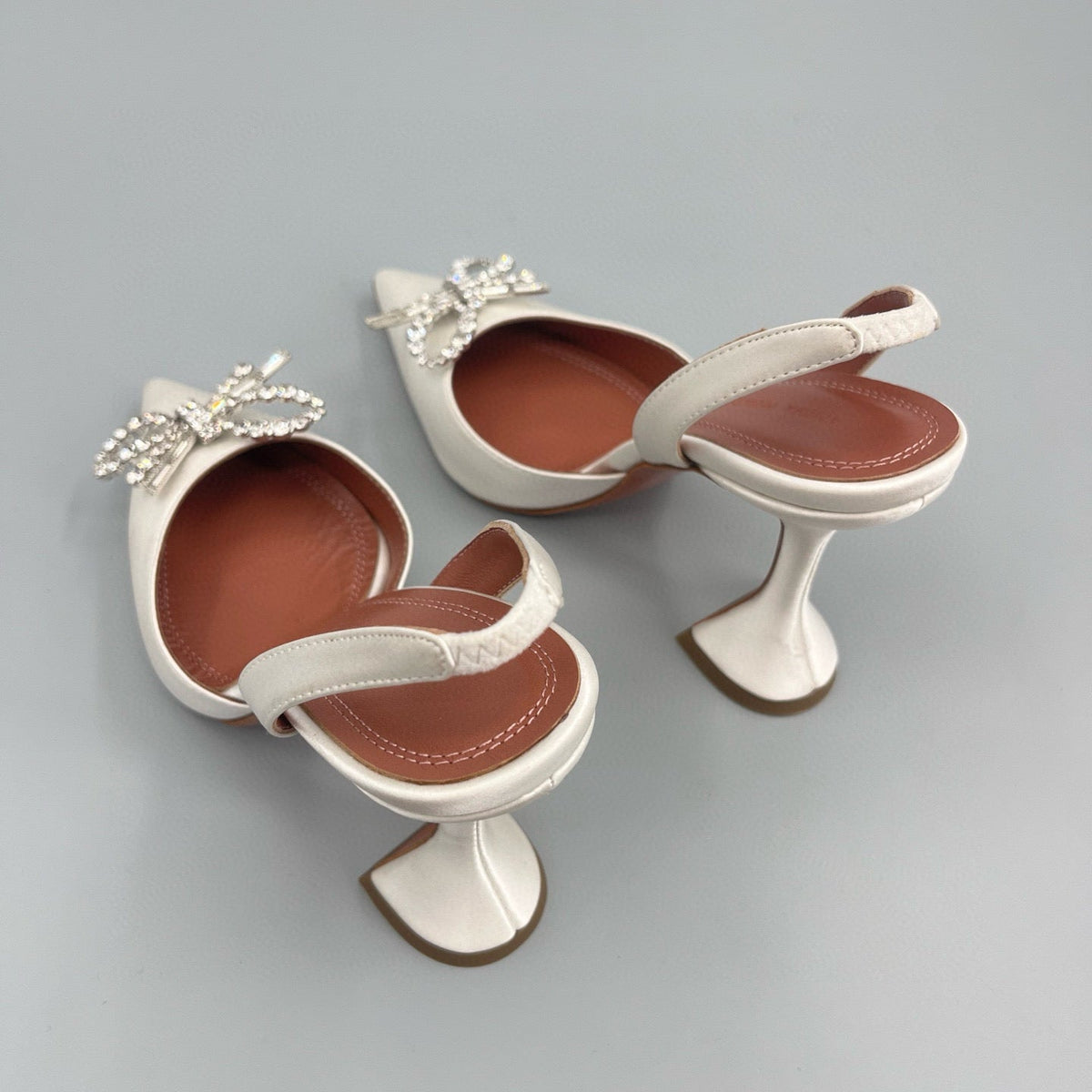 AMINA M HEELS