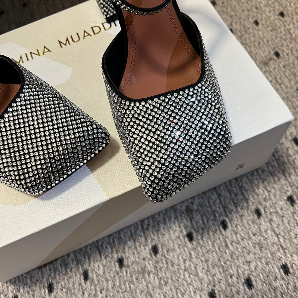 AMINA M HEELS