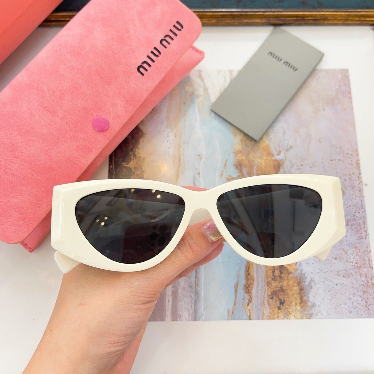 MIU M SUNGLASSES