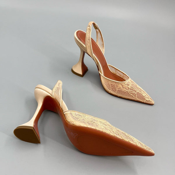 AMINA M HEELS