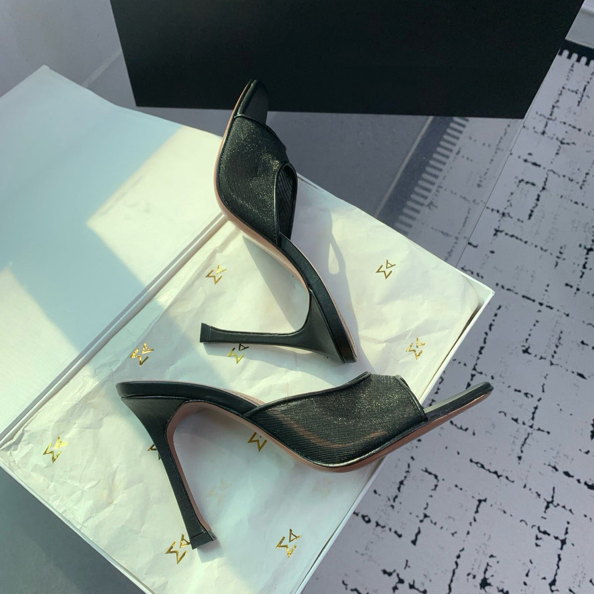 AMINA M HEELS