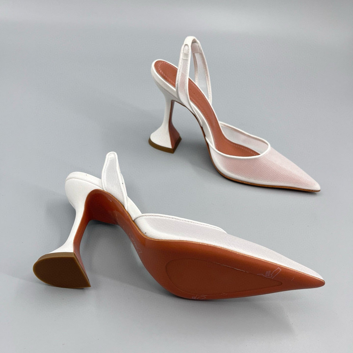 AMINA M HEELS