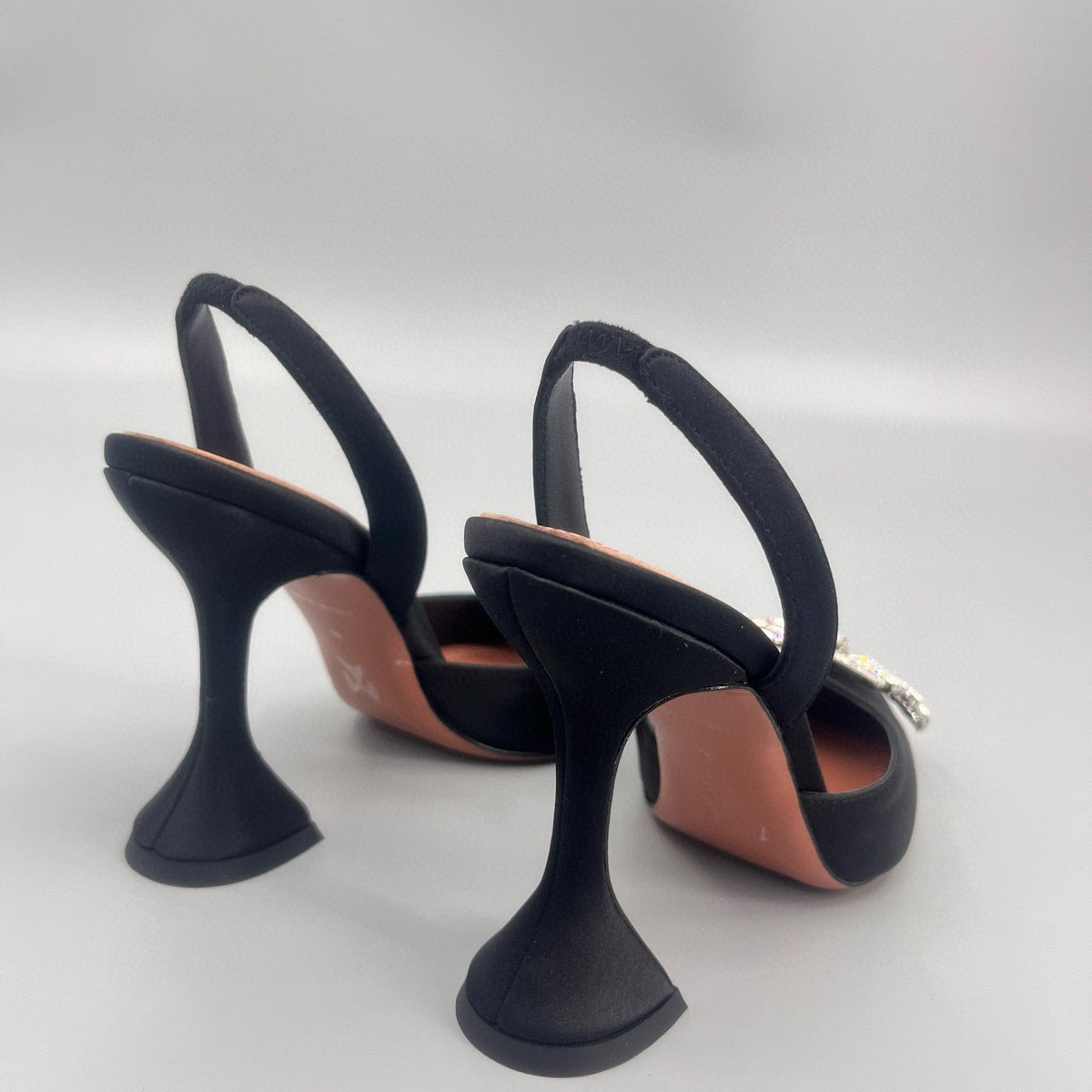 AMINA M HEELS