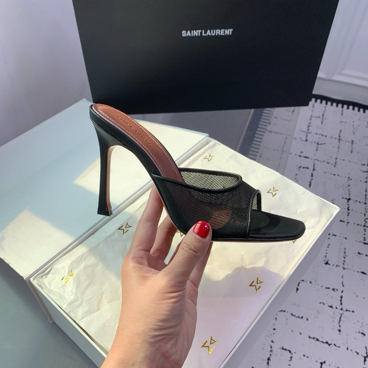 AMINA M HEELS