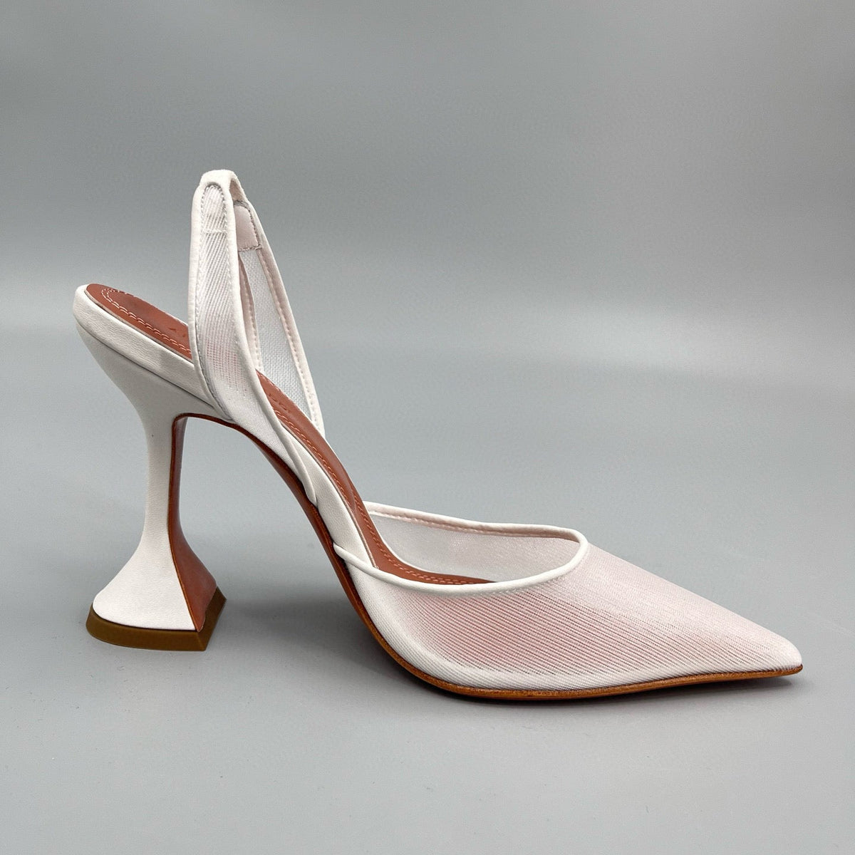 AMINA M HEELS