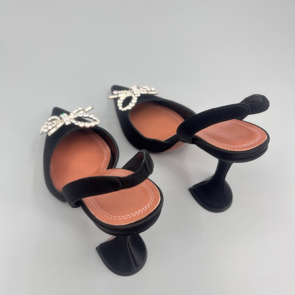 AMINA M HEELS