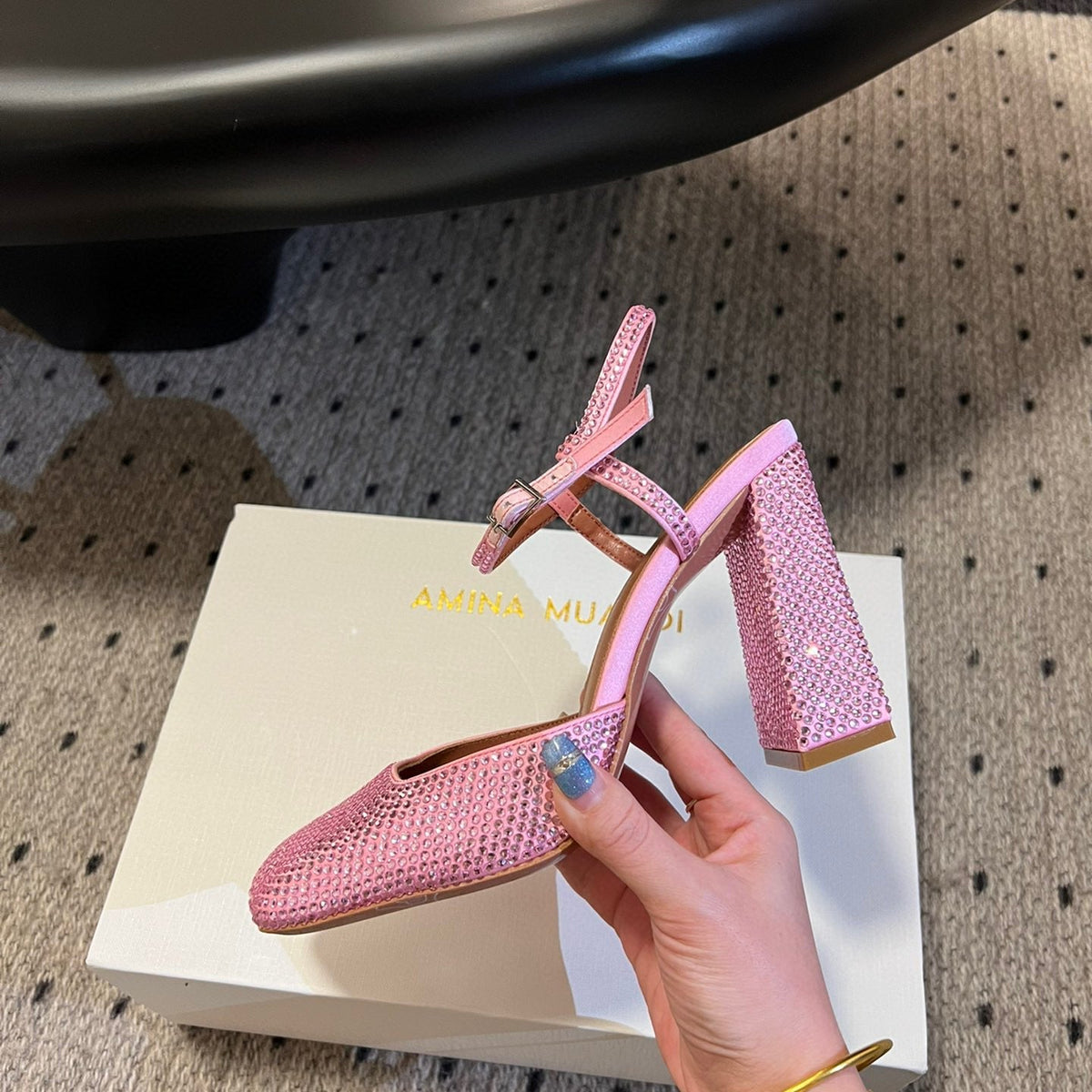 AMINA M HEELS