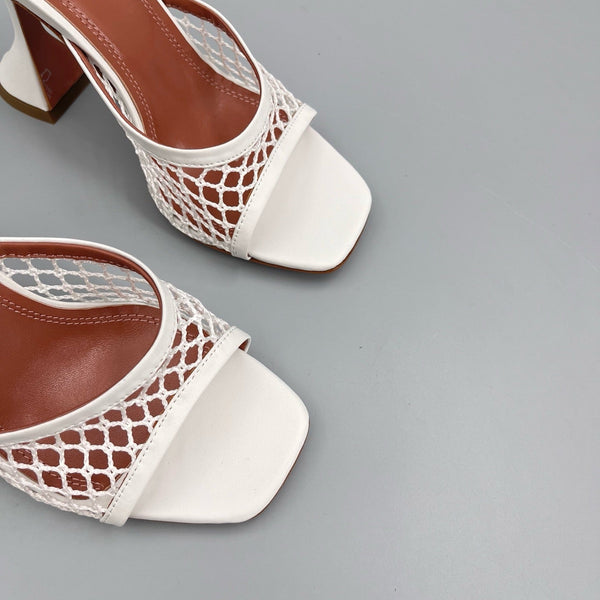 AMINA M HEELS