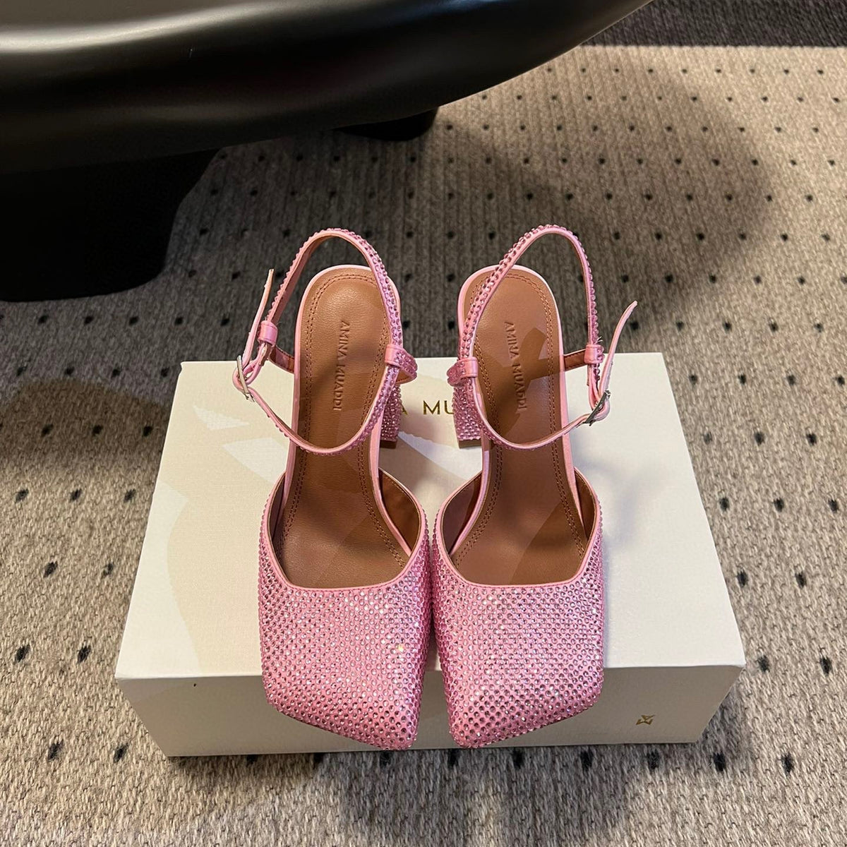 AMINA M HEELS