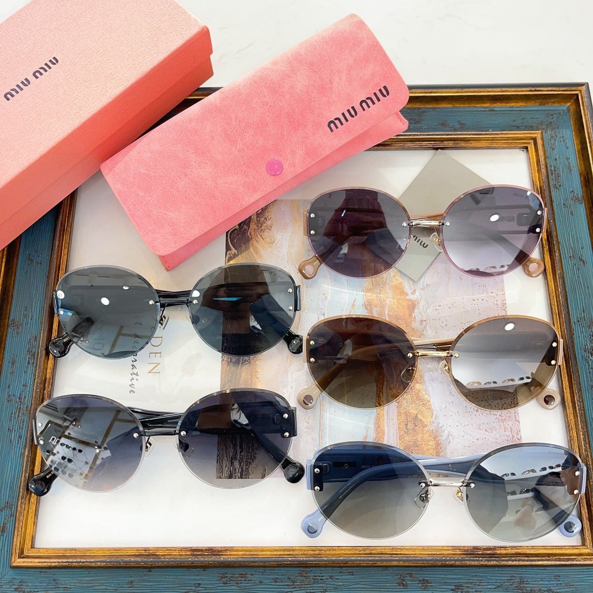 MIU M SUNGLASSES