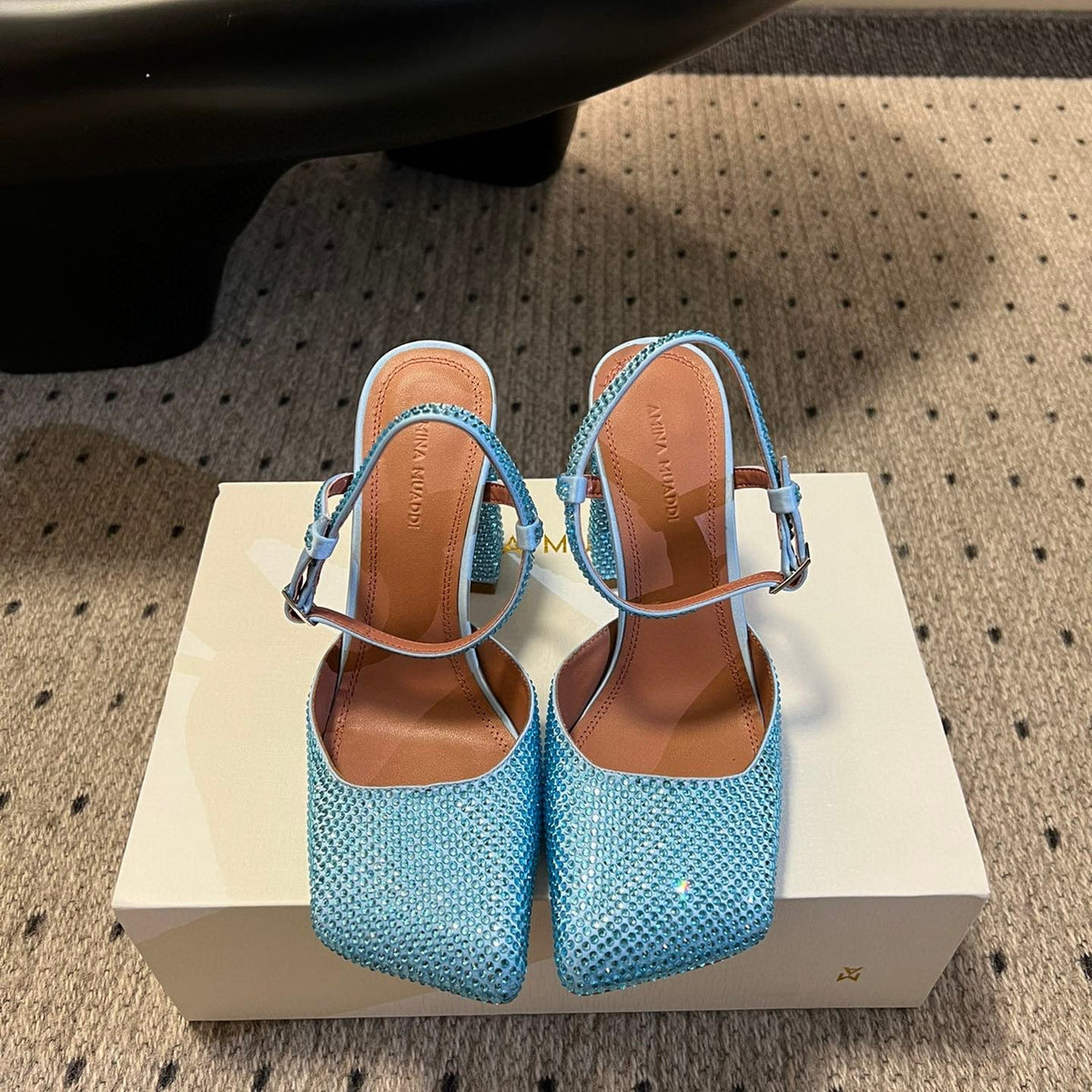 AMINA M HEELS