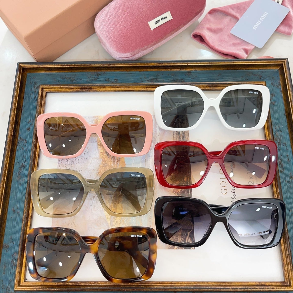 MIU M SUNGLASSES