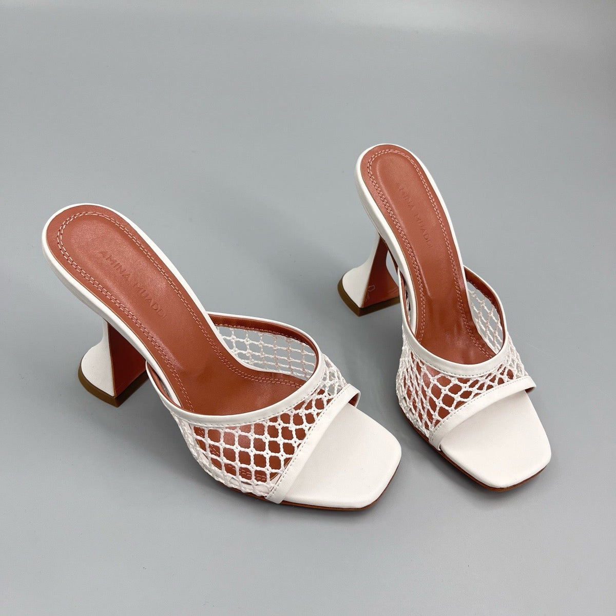 AMINA M HEELS