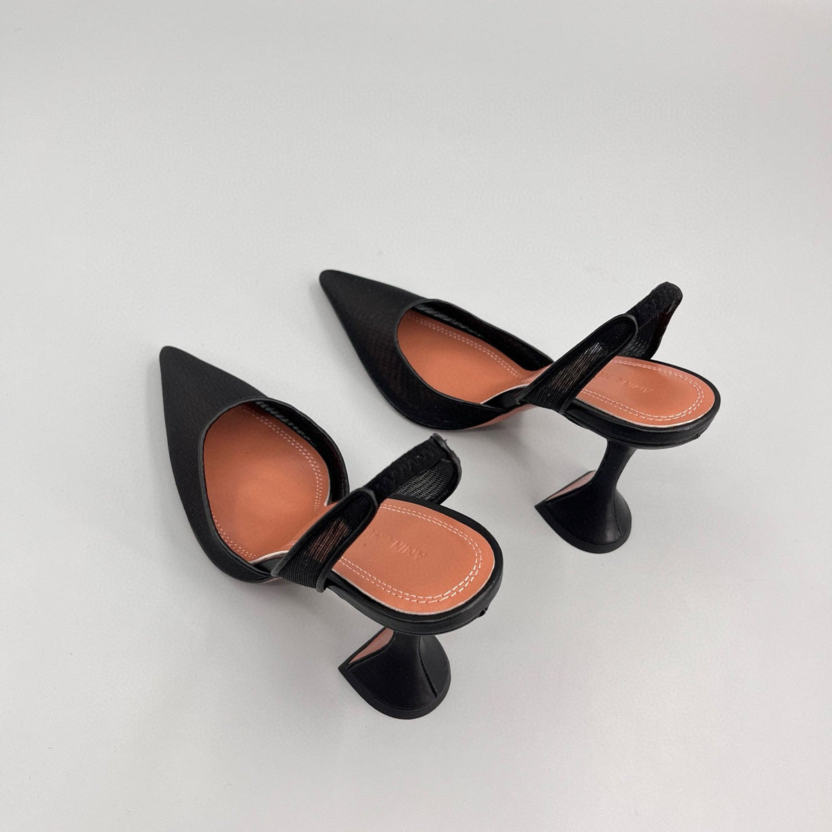 AMINA M HEELS