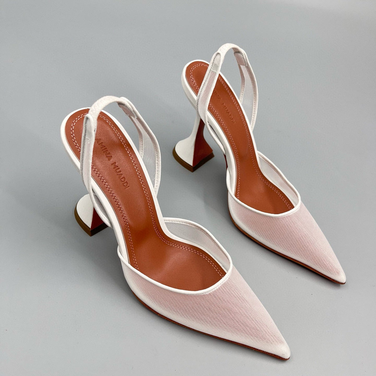 AMINA M HEELS