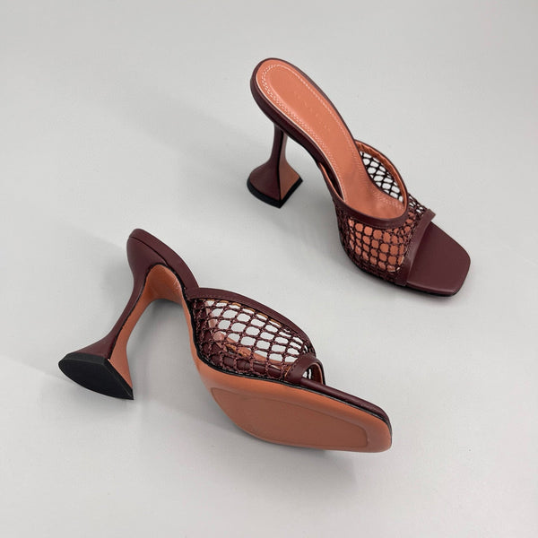 AMINA M HEELS