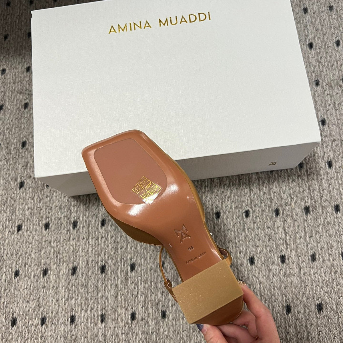 AMINA M HEELS