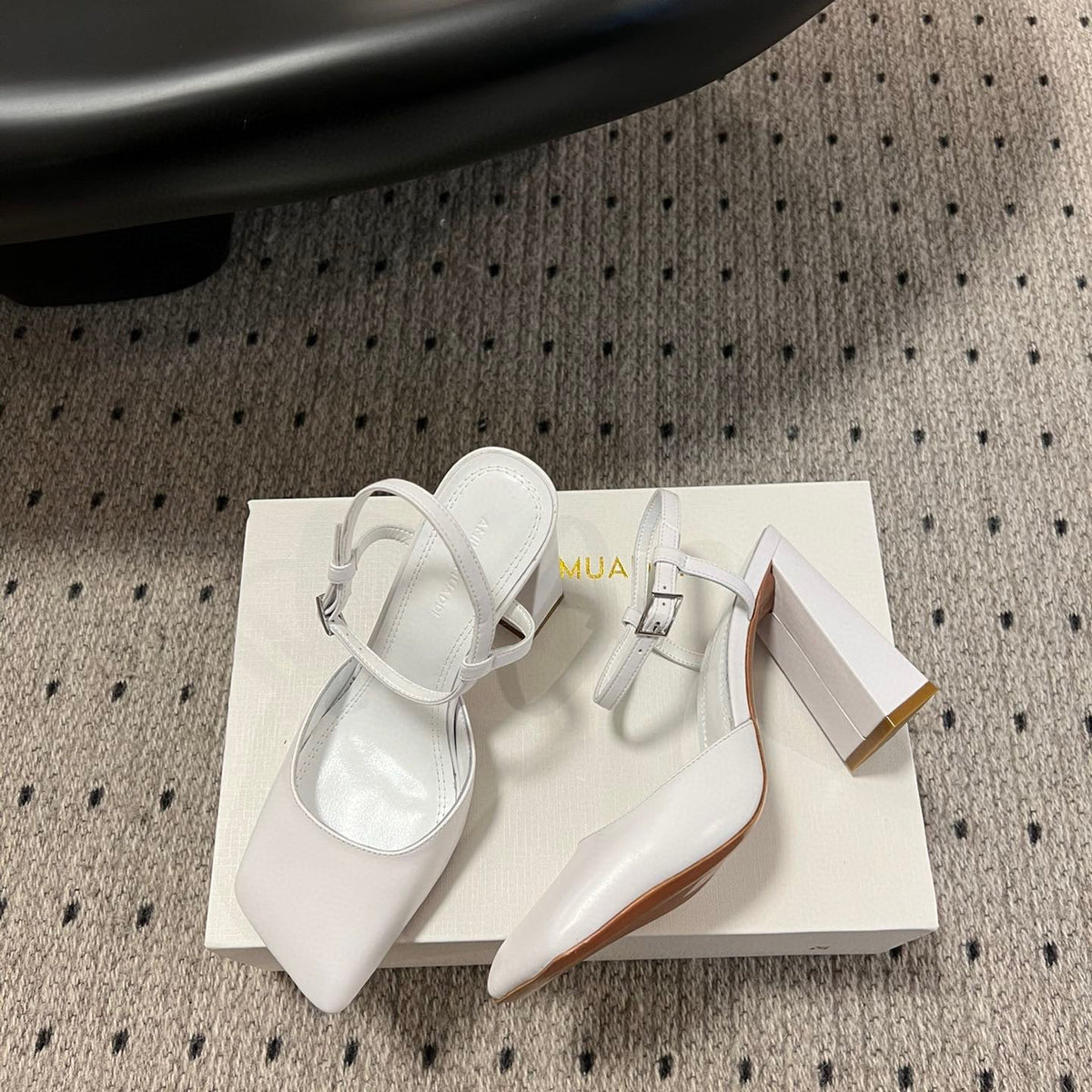 AMINA M HEELS