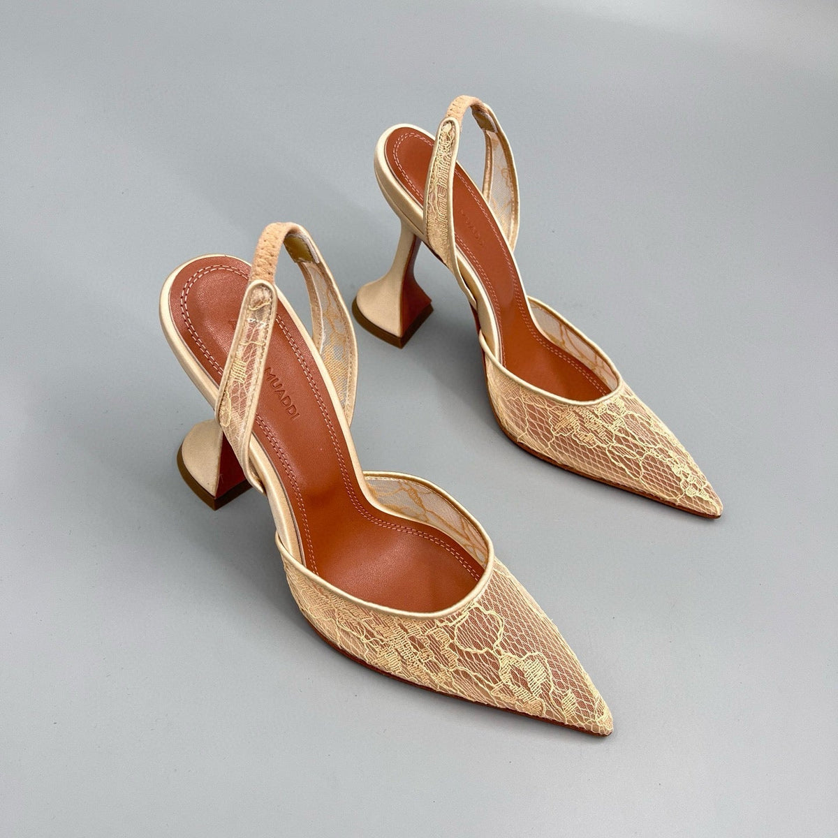 AMINA M HEELS