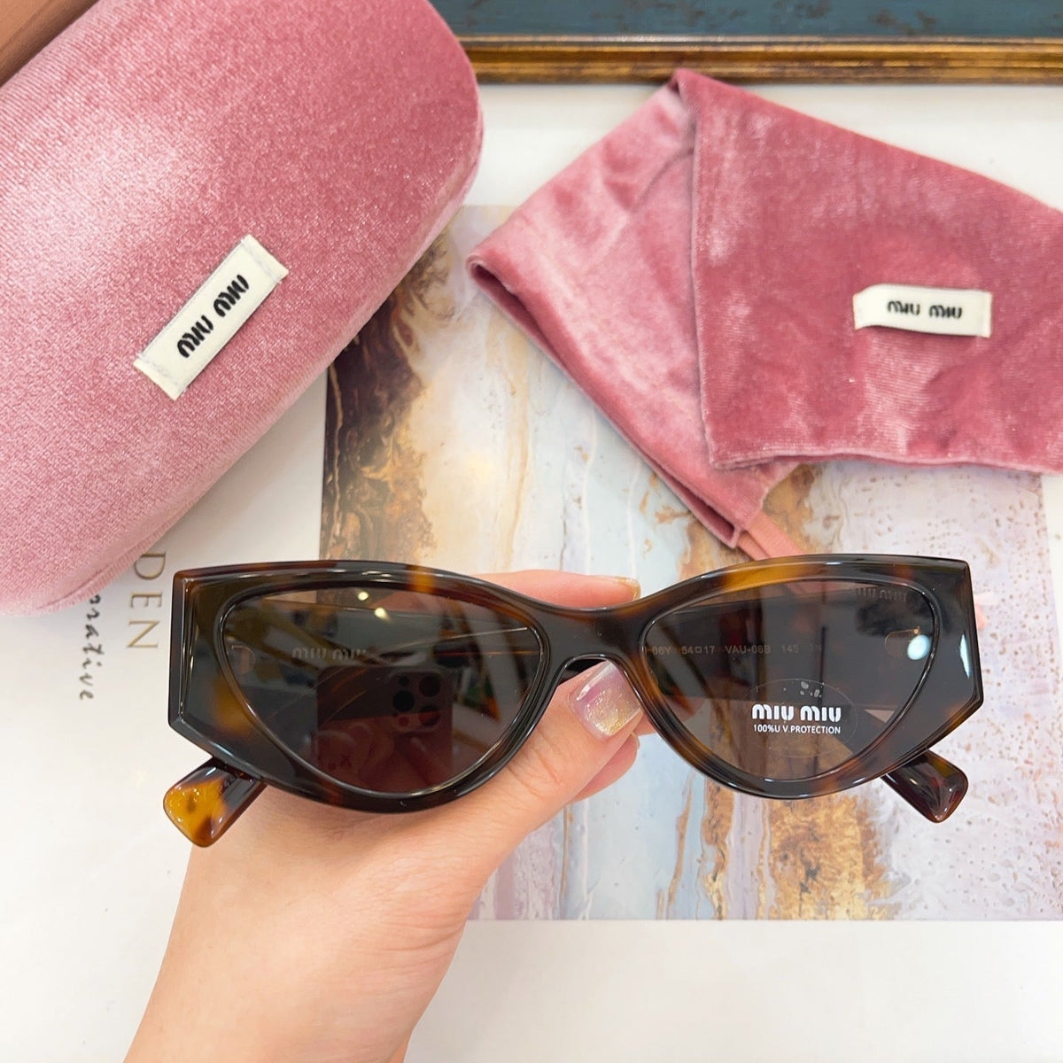 MIU M SUNGLASSES