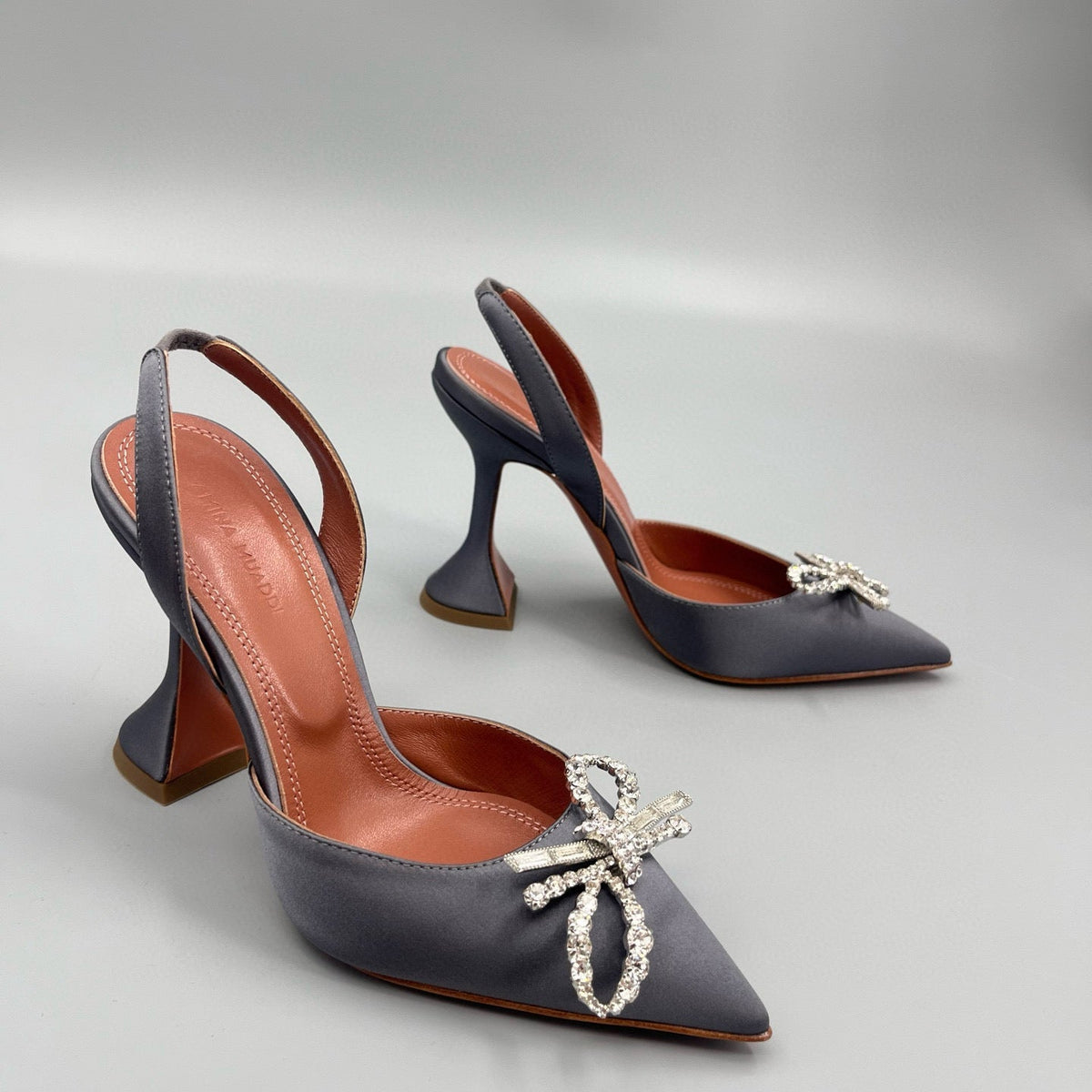 AMINA M HEELS