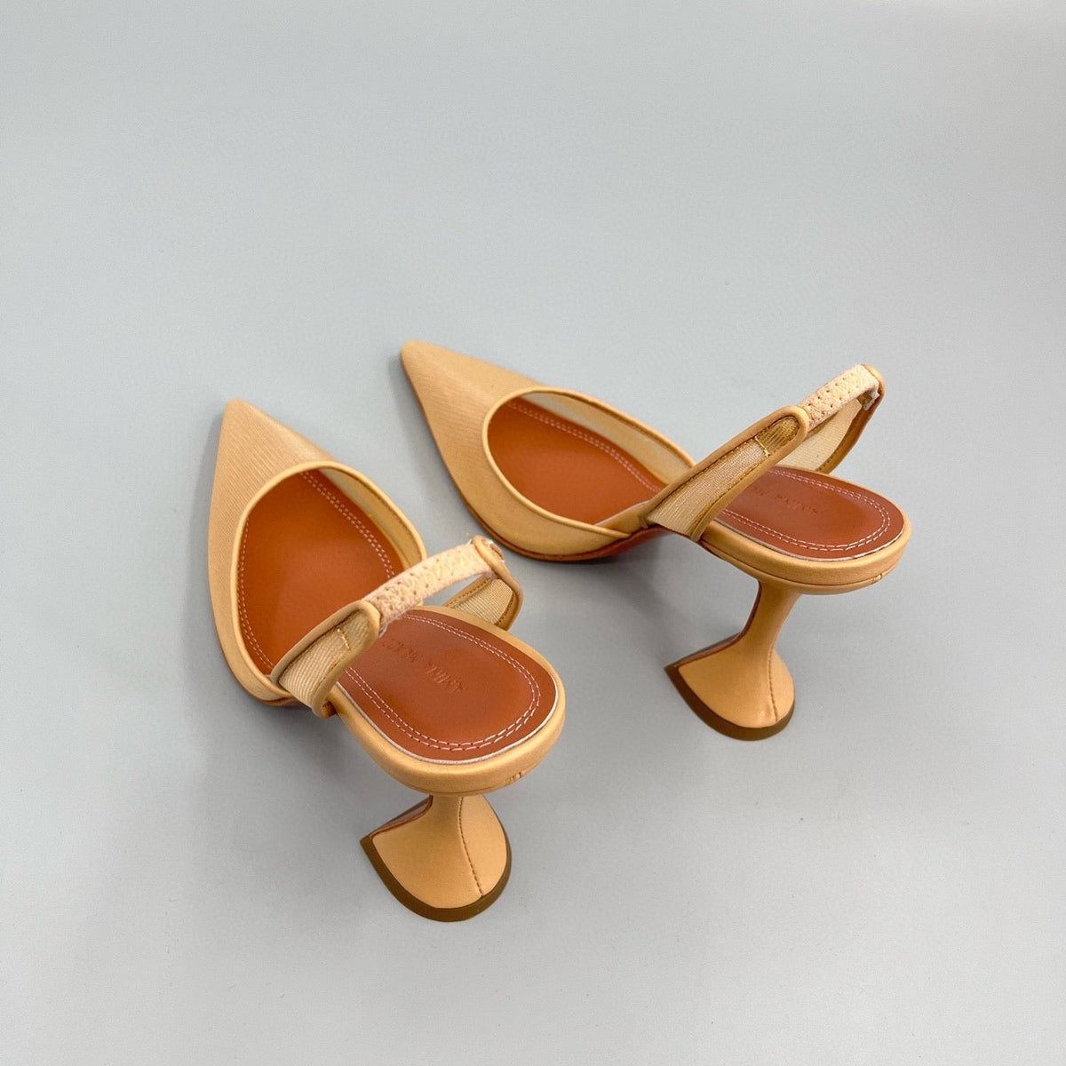 AMINA M HEELS