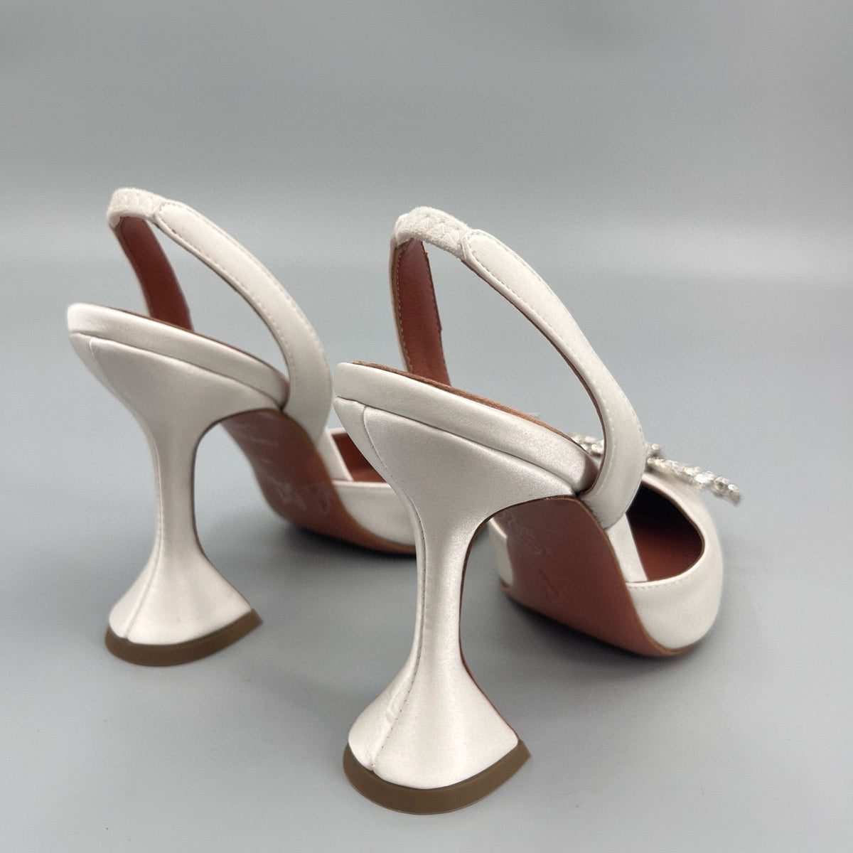 AMINA M HEELS