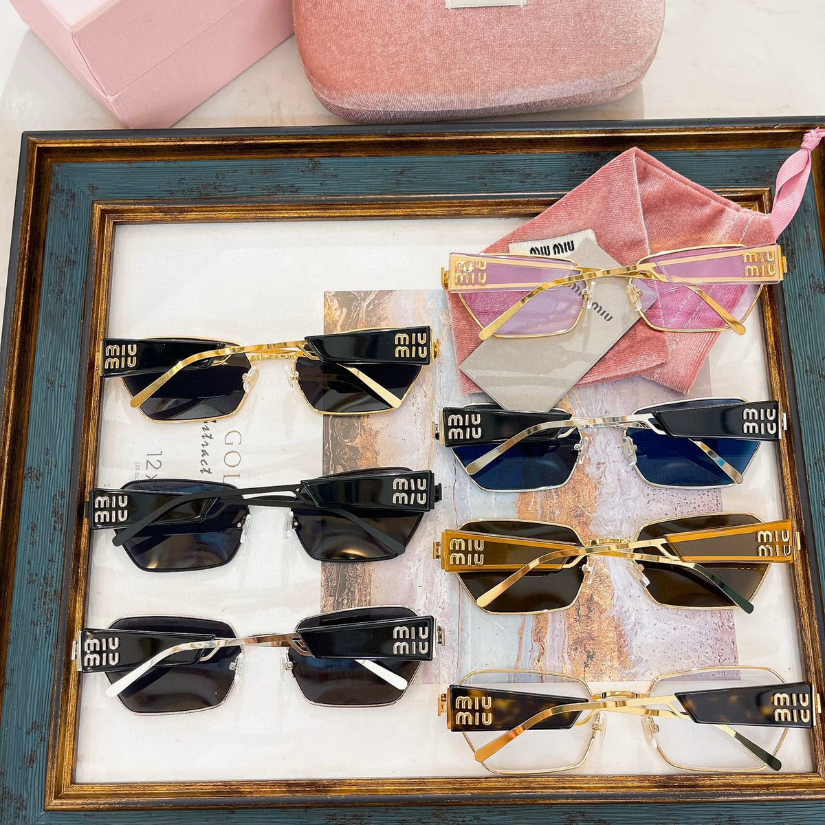 MIU M SUNGLASSES