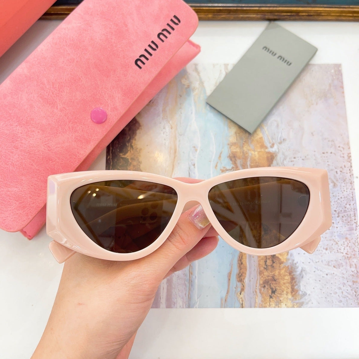 MIU M SUNGLASSES