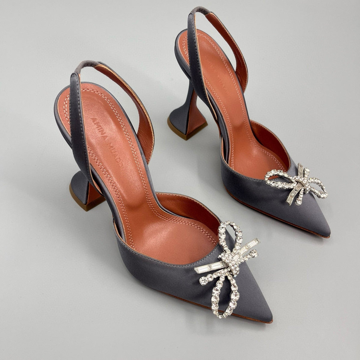 AMINA M HEELS