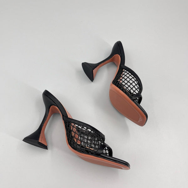AMINA M HEELS