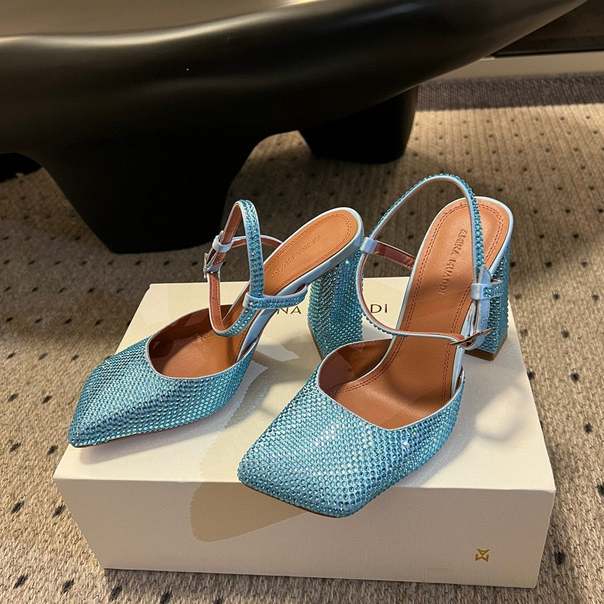 AMINA M HEELS