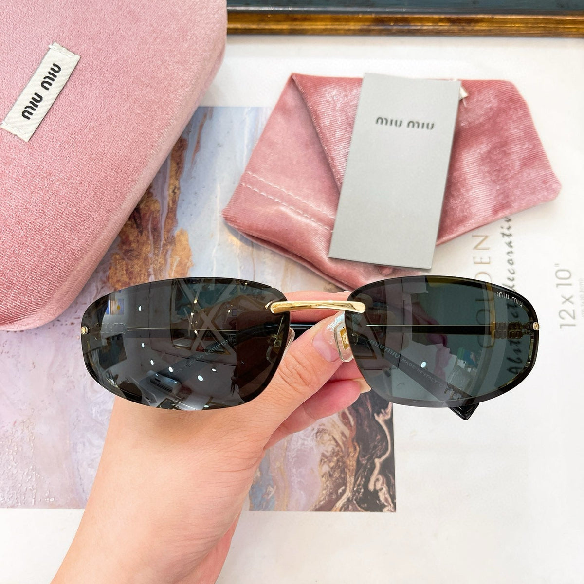 MIU M SUNGLASSES