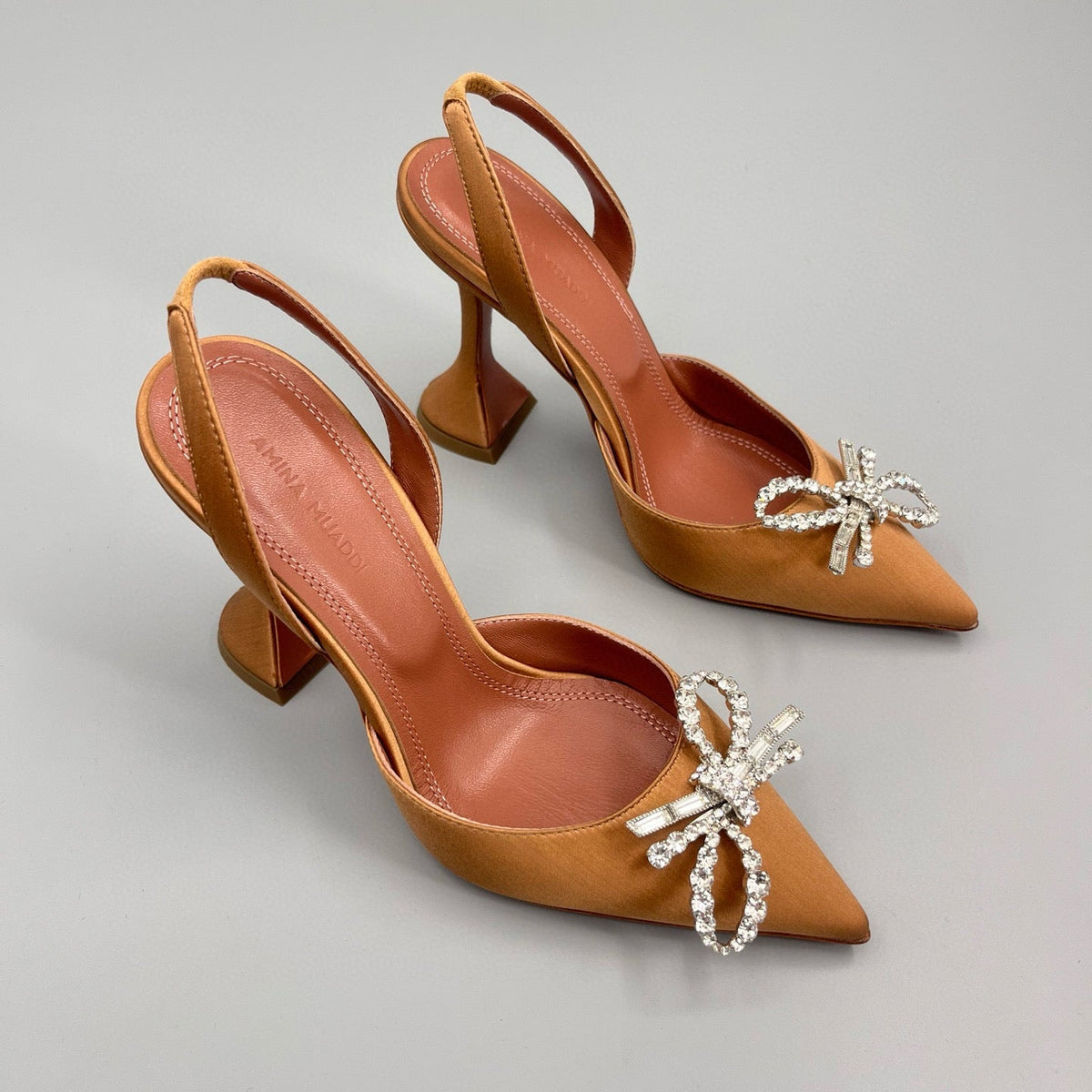 AMINA M HEELS