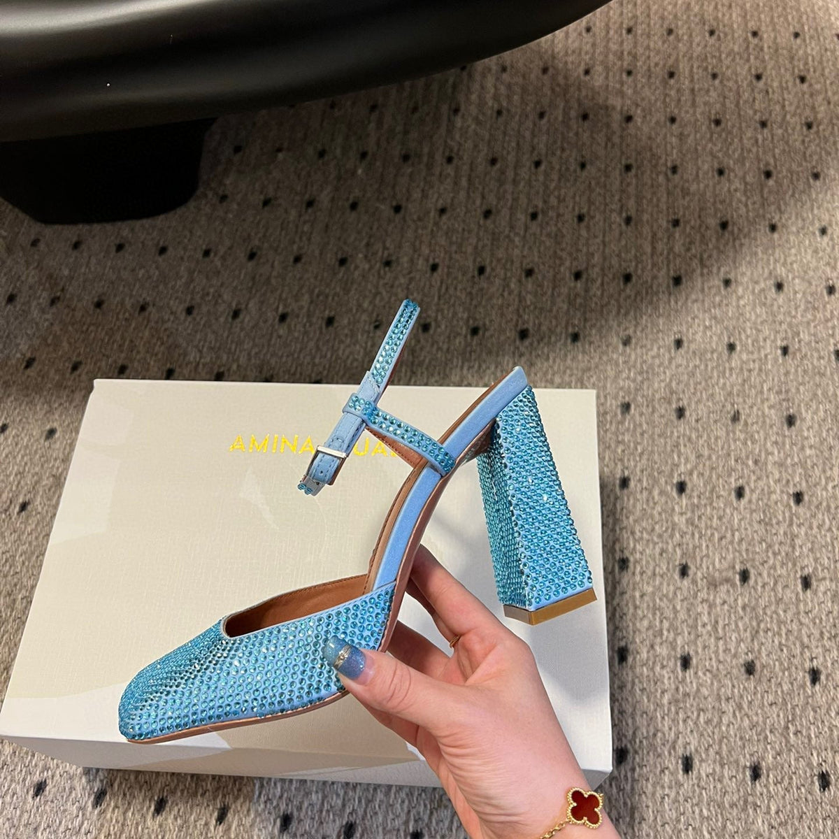 AMINA M HEELS