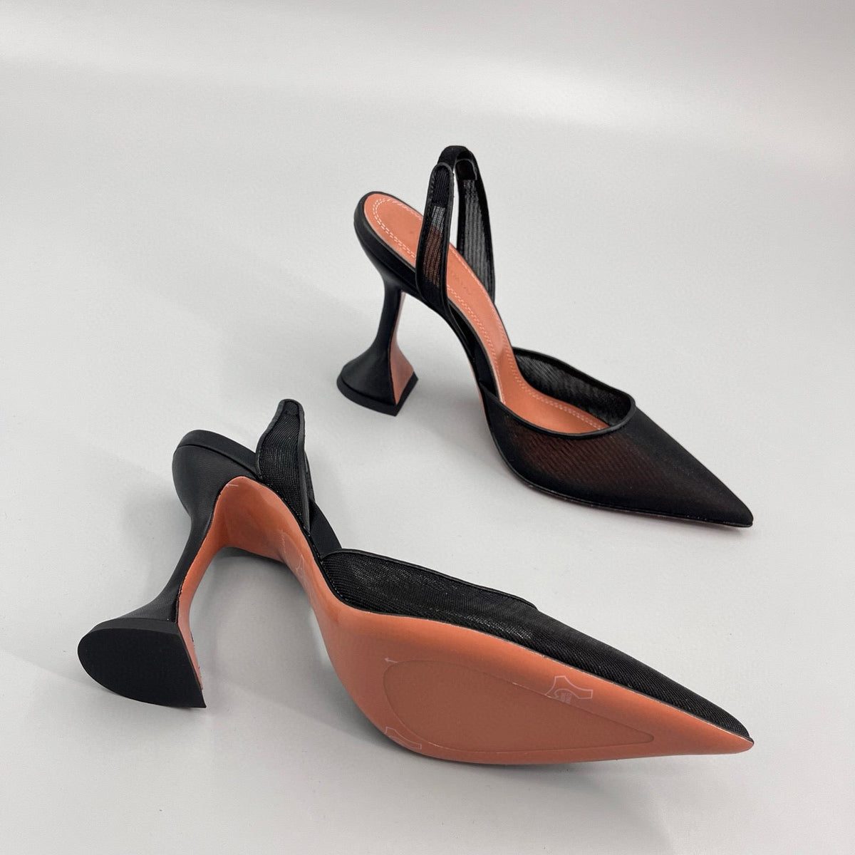 AMINA M HEELS
