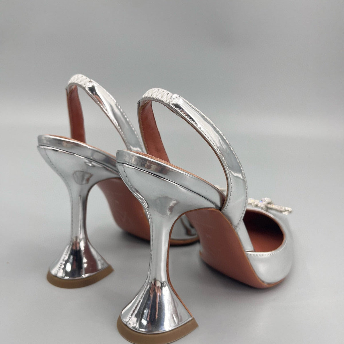 AMINA M HEELS