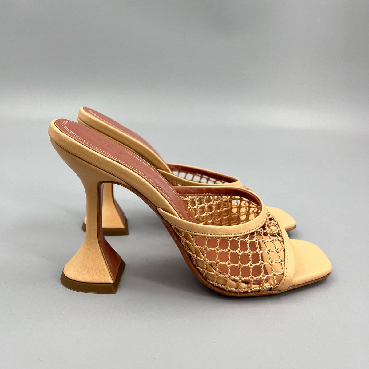 AMINA M HEELS