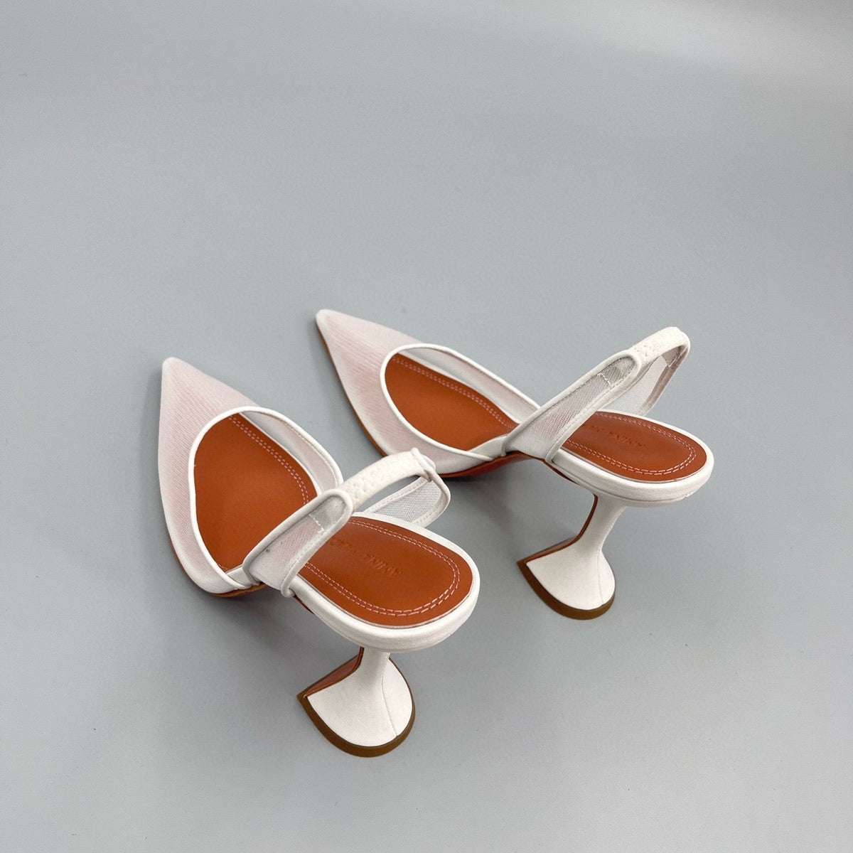 AMINA M HEELS