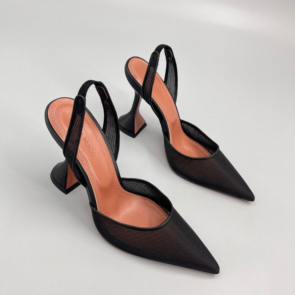 AMINA M HEELS