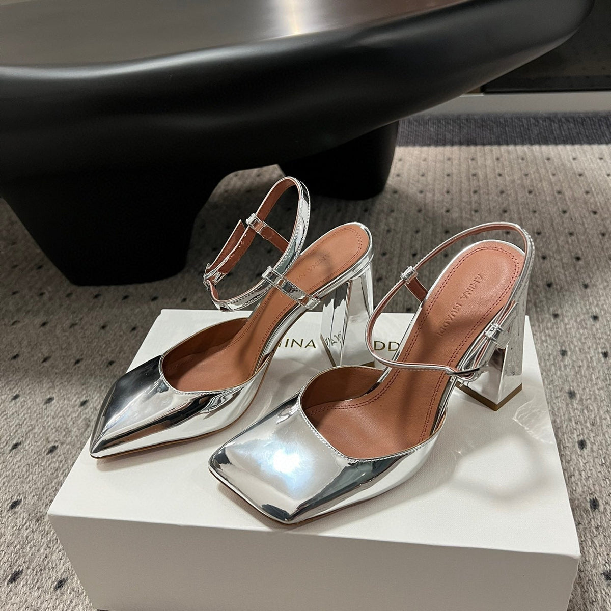 AMINA M HEELS