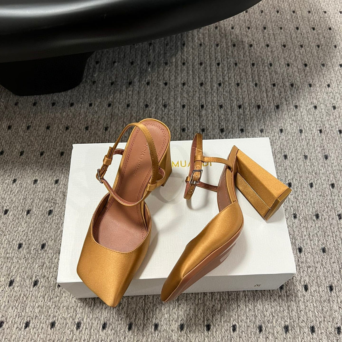 AMINA M HEELS